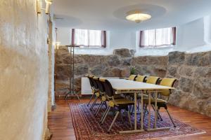 a dining room with a table and chairs at Home Hotel Victoria in Jönköping
