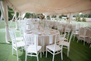a table set up for a wedding under a tent at Les gites du Valjoly in Touvent +54 photos