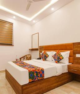 a bedroom with a bed in a room at HOTEL AMBASSADOR SUKHNA LaKE in Chandīgarh +23 photos