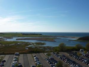 an aerial view of a parking lot next to the water at Ostsee-Ferienpark in Heiligenhafen