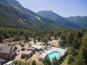 an aerial view of a resort with a swimming pool at Huttopia La Clarée in Val-des-Prés