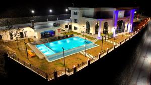 an overhead view of a swimming pool in front of a house at Gelevera Park - Otel Spa Restaurant in Espiye