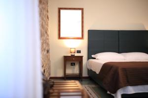 Postel nebo postele na pokoji v ubytování Bienestar - Maison de Charme