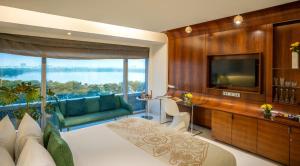 a living room with a television and a couch at The Park Hyderabad, Banjara Hills near Hussain Sagar Lake in Hyderabad