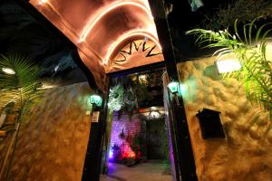 an entrance to a building at night with lights at Sunset Inn in Eilat