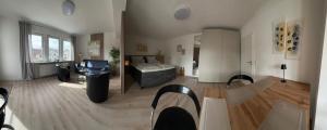 a living room with a couch and a bed at Marktplatzapartment 3 in Höxter