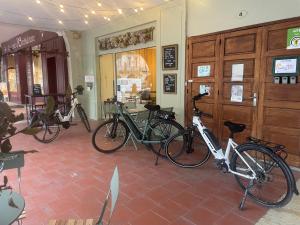 a group of bikes parked in a room at couleurs d'ici in Fleurance