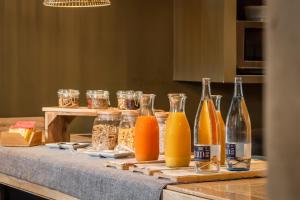 a table with bottles of orange juice and other ingredients at Hotel SB Express Tarragona in Tarragona