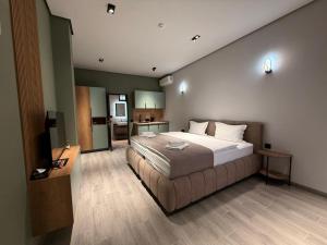 a bedroom with a large bed in a room at Mountain Symphony House Dilijan in Dilijan +59 photos