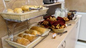 a bakery with bread and pastries on a counter at Star Hotel by Mellow Mood Hotels in Budapest