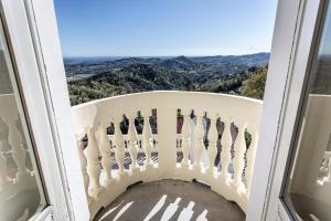 a balcony with a view of the mountains at Moleloca - Casa Bacolla in Cocconato