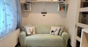 a green chair in a corner of a room at Inveraray Farm in Beaufort