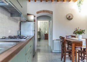 a kitchen with a sink and a stove top oven at Bed & Bike Casa dei Papi in Portoferraio +57 photos