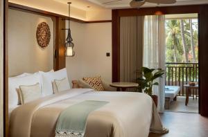 a bedroom with a large bed and a balcony at Paradisus by Meliá Bali in Nusa Dua +132 photos