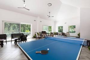 a room with a pool table in it at Tusker Trails - A LuxUnlock Private Retreat in Suntikoppa