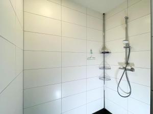 a shower with two shower heads on the wall at Diemelblick 22 - SEEBLICK in Heringhausen +36 photos