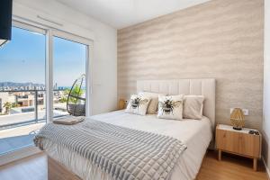 a bedroom with a large bed with a large window at Stunning House, 3BR, HOT TUB, WIFI, Parking in Finestrat +64 photos