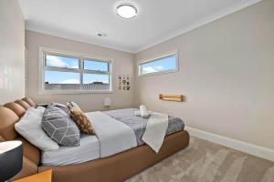 a bedroom with a large bed and a window at Charming 5-Bedroom House in Harrison