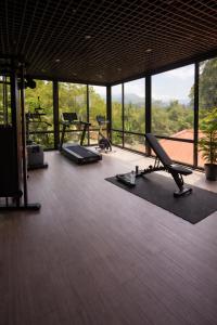 a living room with a gym with a large window at DreamSide Aparthotel in Batumi