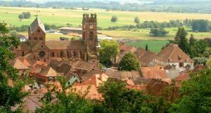 a village with a church and a clock tower at Belle petite maison de 70m2 in Neuwiller-lès-Saverne