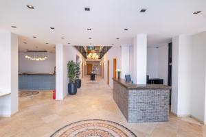 a lobby with a reception desk in a building at Casa Alloro Bodrum in Bodrum City +69 photos