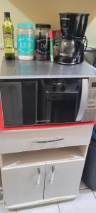 a microwave oven sitting on top of a counter at Joy Hostel in Salvador