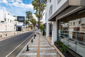 an empty city street with a building and a store at Casa Alloro Bodrum in Bodrum City