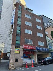 a building with a car parked in front of it at StayShim in Seoul