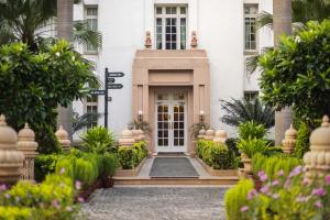 a front door of a building with plants at The Imperial, New Delhi in New Delhi