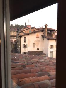 a view from a window of a tile roof at Casa Vacanze Funicolare in Bergamo