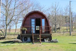 a small tree house in a field at Quinta Da Devesa B1 in Vinhais