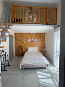a bedroom with a bed in the middle of a room at Maison au calme proche accès rocade in Montauban