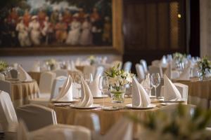 a dining room with tables with white chairs and white napkins at The Imperial, New Delhi in New Delhi +68 photos