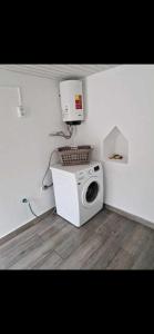 a microwave sitting on the floor in a room at Casa Vanda, Machico in Machico