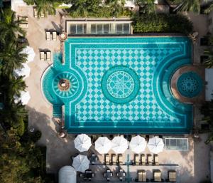 an overhead view of a swimming pool with a resort at The Imperial, New Delhi in New Delhi