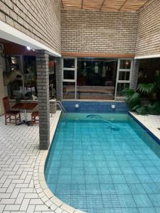 a swimming pool in the middle of a house at Lens BnB Guesthouse in Benoni
