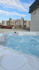 a hot tub on the roof of a building at Royal Rest Apartments Karlovac-Luxury, Central Location & Free Parking in Karlovac