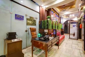 a office with a desk and a chair in a room at Hotel The Metropolis Tourist Near Connaught Place And Ramakrishna Ashram Marg Metro Station in New Delhi