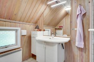 a bathroom with a sink and a window at Søndervang 4 in Nørre Nebel +27 photos