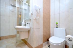 a bathroom with a toilet and a sink at Partez Hotel in Yerevan +40 photos