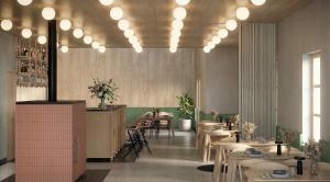 a dining room with tables and chairs and lights at Vila Soča in Bovec