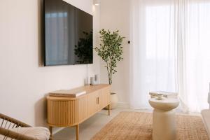 Apartment Marla tesisinde bir televizyon ve/veya eğlence merkezi