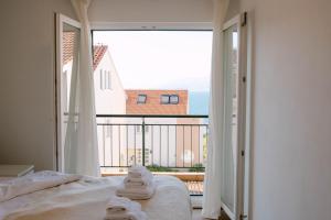 Apartment Marla tesisinde bir odada yatak veya yataklar +13 fotoğraf