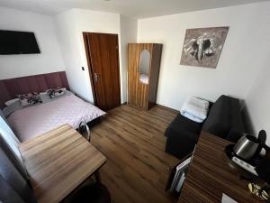 a small room with a bed and a table at Andromeda in Mikoszewo
