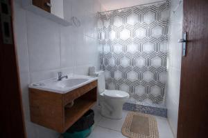 a bathroom with a sink and a toilet and a shower at Pousada Campina do Monte Alegre in Campina do Monte Alegre +54 photos