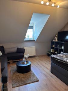 a living room with a couch and a table at Päächenhof in Sinspelt