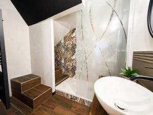 a bathroom with a white toilet and a staircase at Studio Riom - Proche gare SNCF in Riom