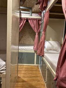 a room with two bunk beds and a window at Lucky beds pg and hostel in Mumbai