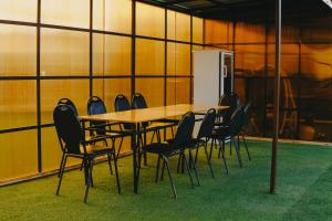 a conference room with a table and chairs at KokTau in Kokshetau