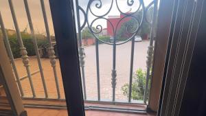 a view of a courtyard seen through a glass door at Imi Ouaddar Sea View Retreat in Agadir